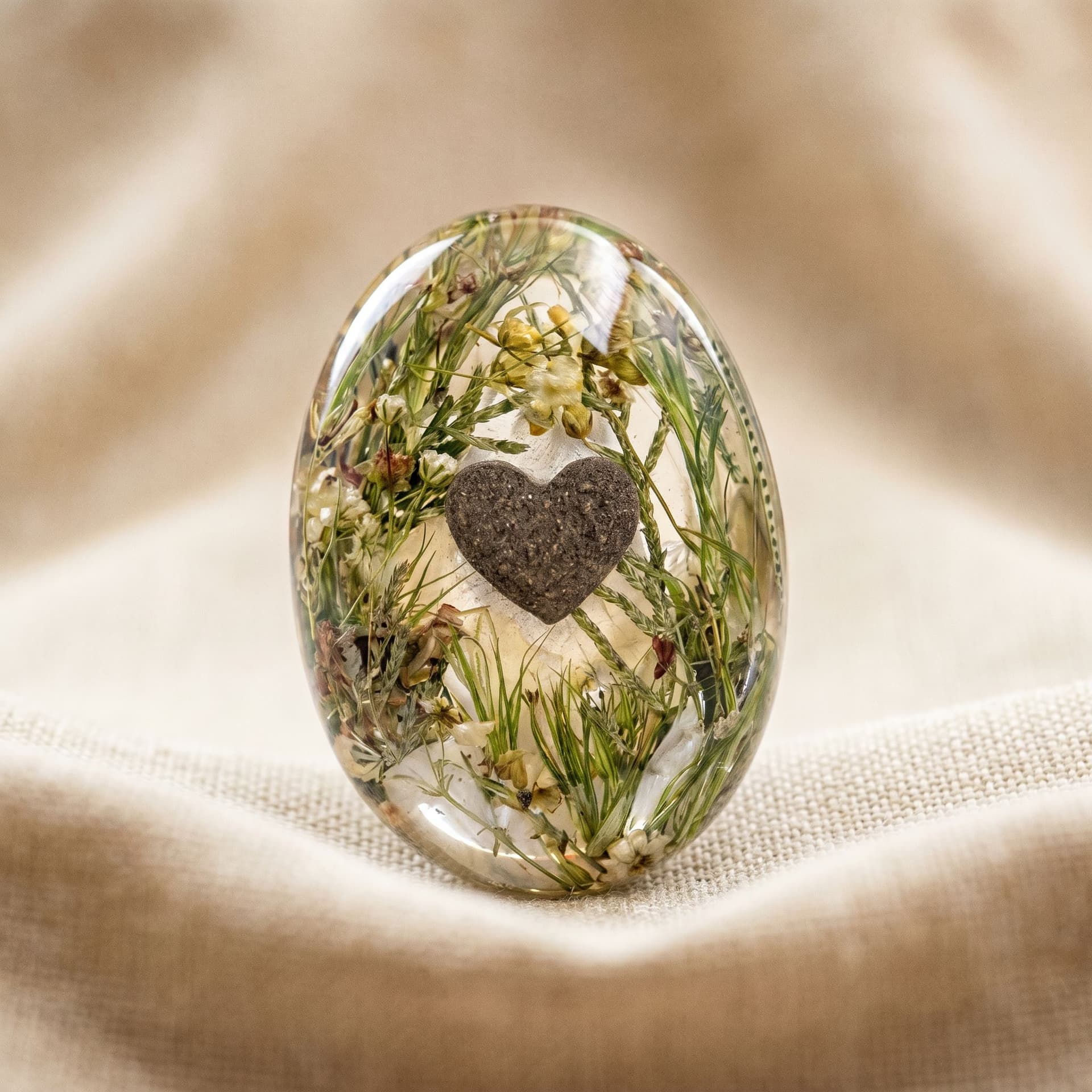 Oval Memory Stone with Heart-Shaped Ashes - close-up detail view, second angle