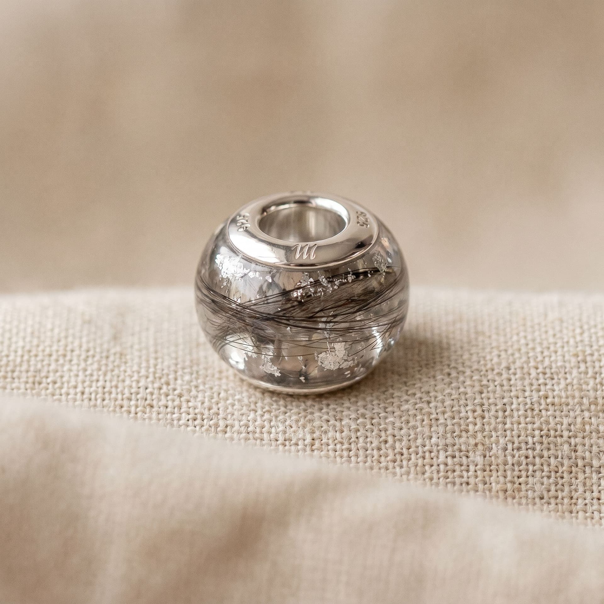 Pandora Charm with Hair - close-up detail view, second angle