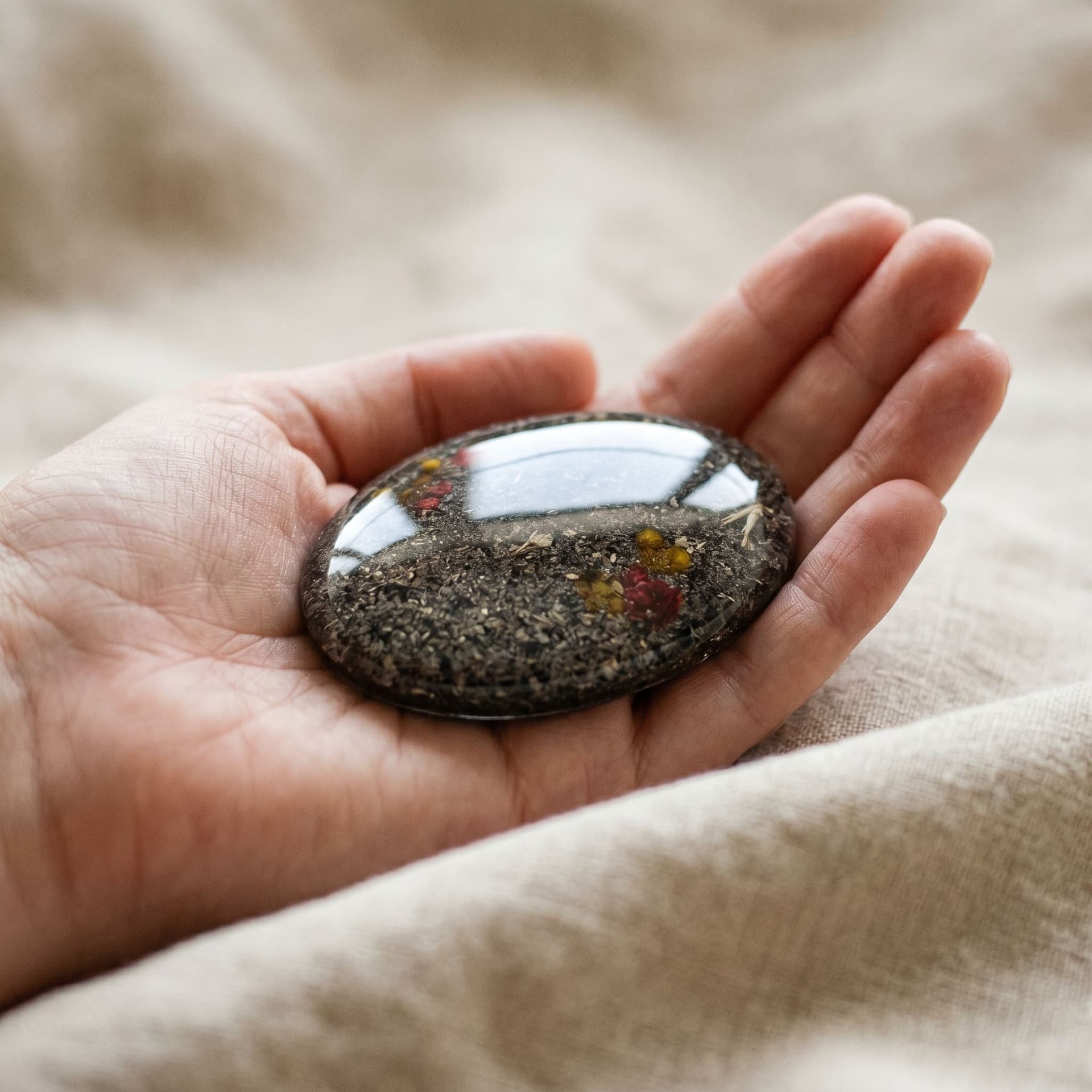 Oval Memory Stone with Ashes & Pet Name - held in hand