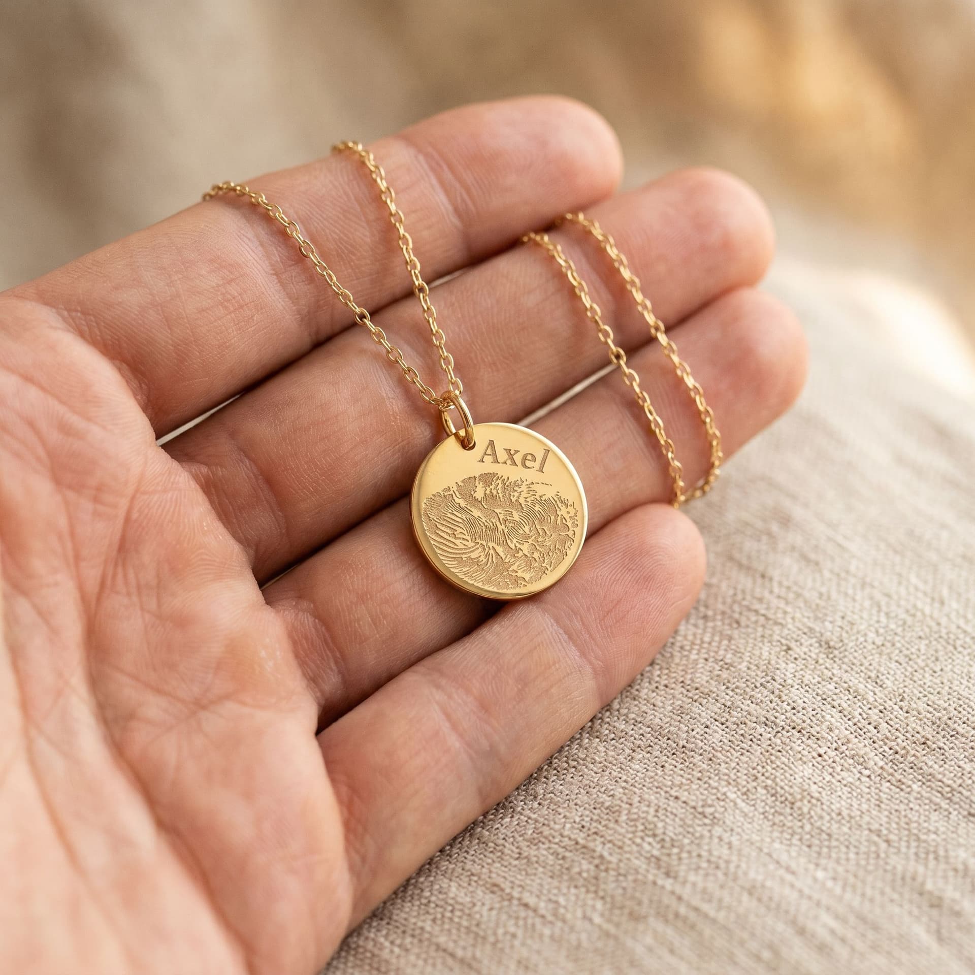 Luna Pendant with Fingerprint - held in hand