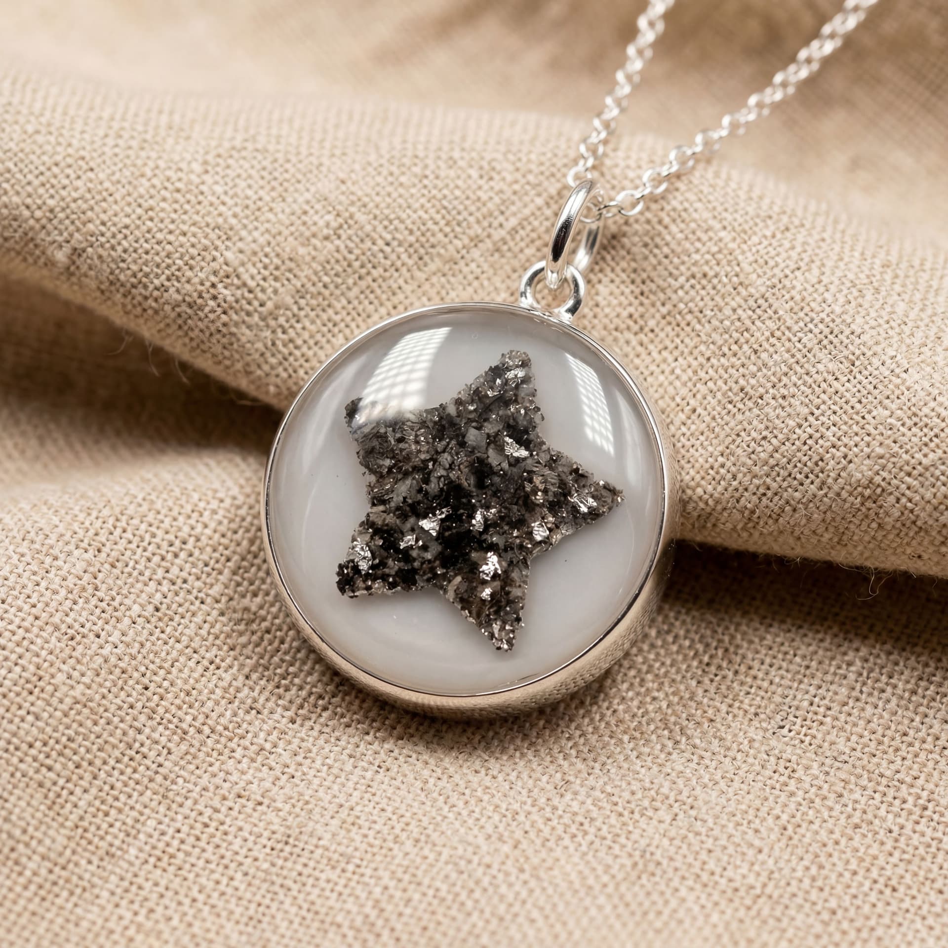Circle of Life Pendant with Arranged Ashes (18 mm) - held in hand, second view