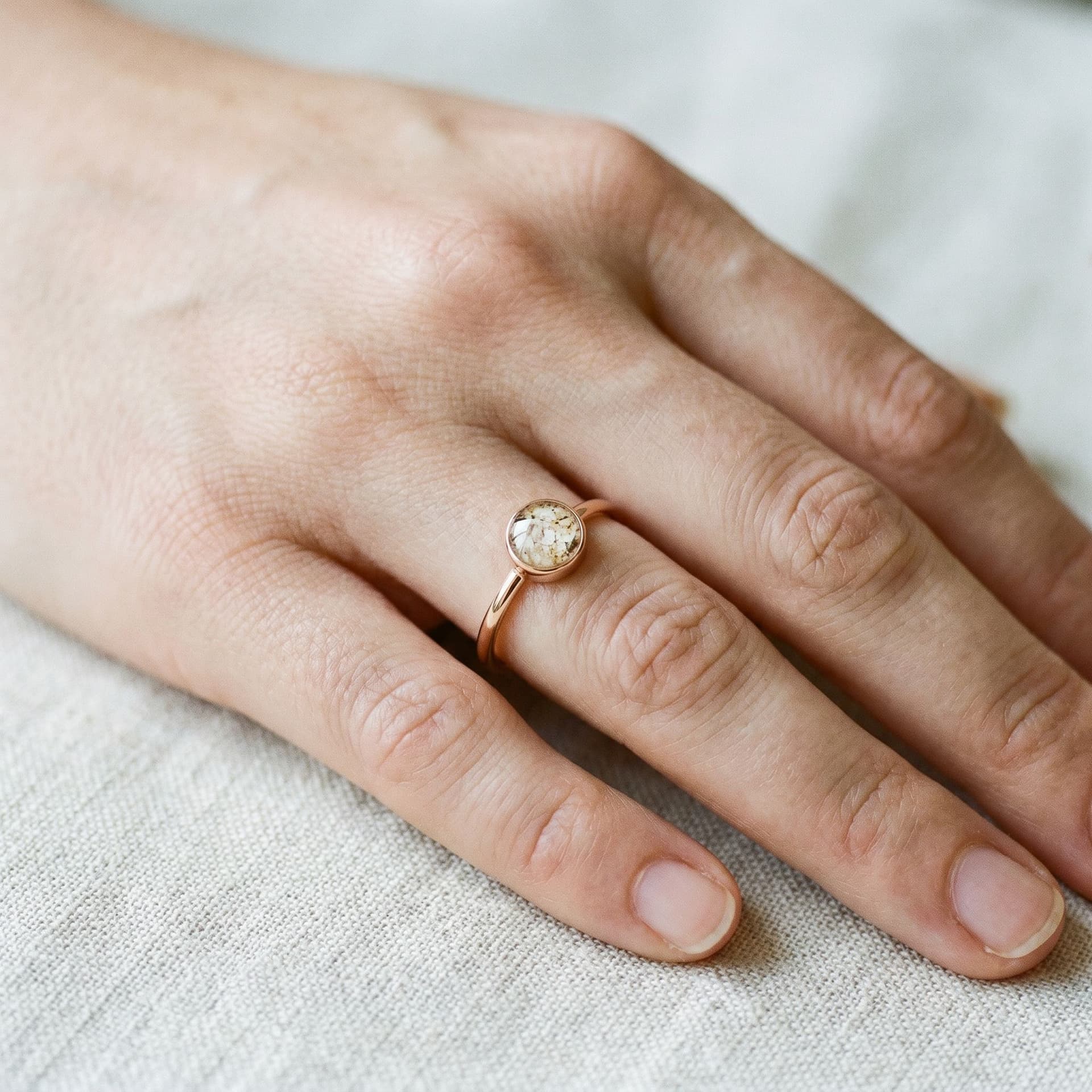 Circle of Life Ring with Ashes - held in hand, second view